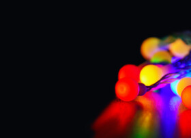 Colourful fairy lights in a dark space